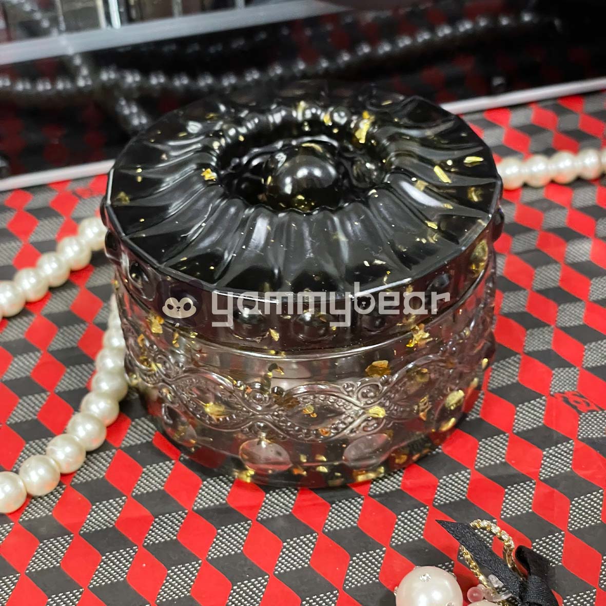 Black and gold round storage box